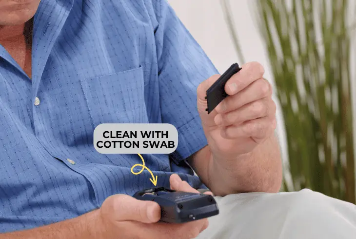 clean the battery contacts on remote